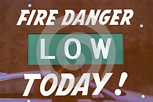 Close up view of a sign that reads Fire Danger Low Today
