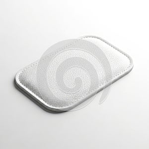 A close-up view of a silver textured rectangular object on a white background