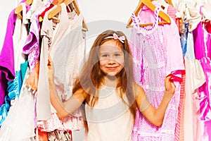 Close-up view of small girl choosing clothes
