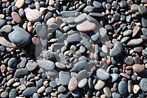Abstract backgroud pattern of pebbles on beach photo