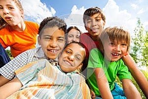 Close up view of smiling kids in a cuddle