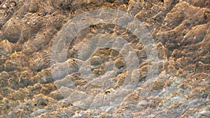 Close up view of smooth round pebble stones on the beach.