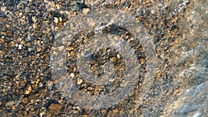 Close up view of smooth round pebble stones on the beach.