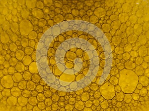 Close-up view of soap bubbles forming a dense, intricate pattern.