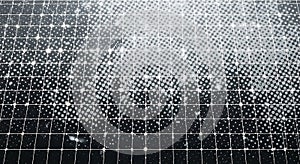 Close-up view of a solar panel surface with a grid pattern and bright reflections of light