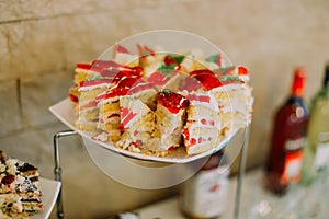 The close-up view of the sponge cakes decorated with red jelly.