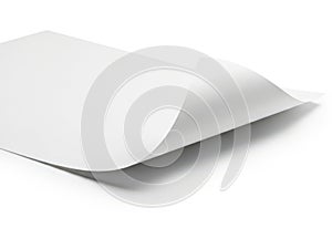 A close-up view of a stack of blank white paper sheets on a white surface