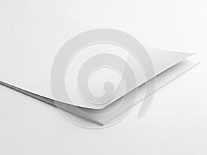 A close-up view of a stack of pristine white paper sheets on a white surface