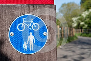 Close-up view of a standard pedestrian and cycle path sign.