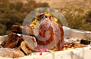 View of stone carved Indian Hindu god Shiva in the shape of Lingam used to offer prayers