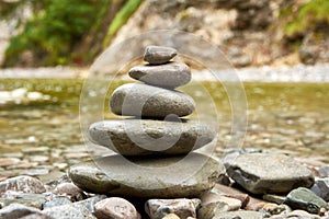 A close-up view of stones folded into a pyramid or pile, with a