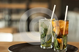 close up view of summertime refreshing drinks on tray