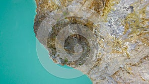 A close up view of the surface of Lake Alapolo and the crater wall. Volcanic lake of Young Men and Maidens Tiwu Nuamuri photo