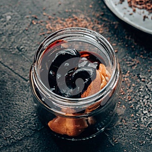 close-up view of sweet delicious homemade chocolate dessert in glass jar