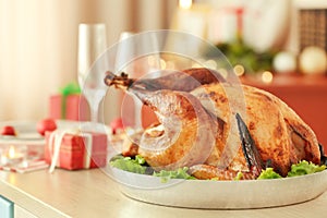 Close up view of tasty turkey prepared for Christmas dinner on blurred background