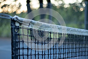Close up view of tennis net on empty tennis court in Stanley Park