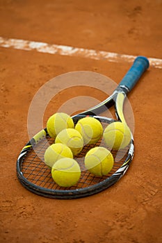 Close up view of tennis racket and balls