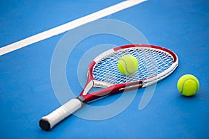 Close up view of tennis racket and balls on the clay tennis court Selective Focus