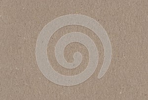 Close up view of textured brown coloured carton paper background.
