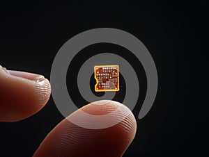 Microchip on Fingertip photo