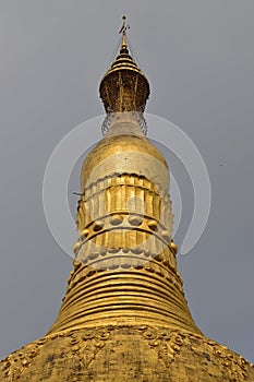 Close up view of tip of common giant stupa in pagoda in Myanmar