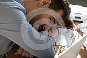 Close up view tired businessman sleeping at workplace