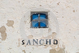 A close-up view to a window of an old windmill on the hill near Consuegra