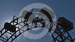 Close-up view of the top of a big Ferris wheel in park Wurstelprater in Vienna, Austria with backlight.