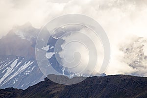 Close up view of the Torres del Paine mountains between the clouds, Torres del Paine National Park, Chile