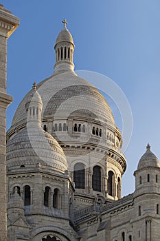 Close-up view of the towers Sacre Coeur Basilica at sunrise, Montmartre, Paris, Fr