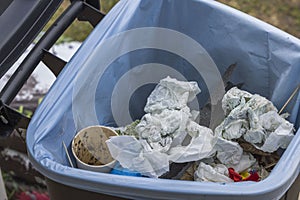 Close up view of trash in garbage container. Pollution, environment concept