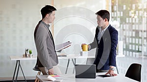 Close up view of two of businessman discussing on their task in modern meeting room