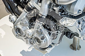Close up view of two turbos on a high performance engine car