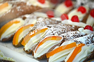 Close up view of typical sicilian cannoli pastry stuffed with ricotta