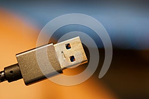 Close up view of USB connector with colorful background