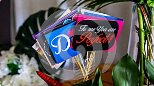 Close up view of the variety colorful wedding wishes placard or party props collections on the table