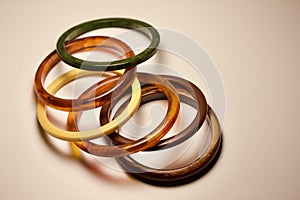 Close up view of vintage bakelite bangle bracelets on white background