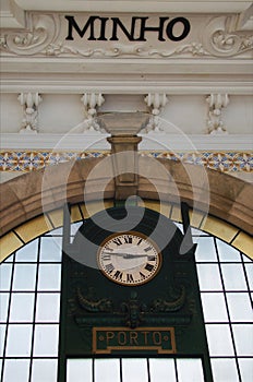 Close-up view of vintage clock in the railway station in Porto, Portugal. station clock in Sao Bento Train Station