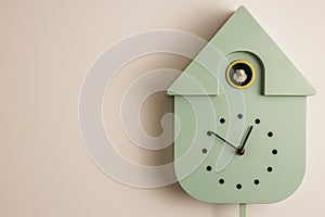 Close up view of wall cuckoo clock on  background.