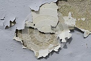 Close-up view of the wall paint peeling off