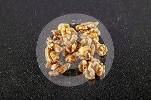 A close up view of walnuts in a pile