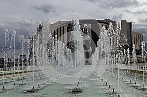 A close-up view of water fountains in front of the National Palace of Culture