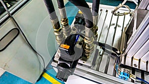 Close up view of 4/3 ways Solenoid Operated Directional Valves connected to hydraulic circuit.