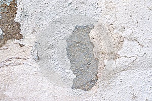 Close up view on white aged concrete walls with cracks and lots of structure
