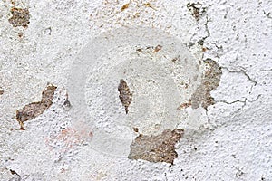 Close up view on white aged concrete walls with cracks and lots of structure