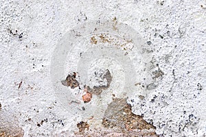 Close up view on white aged concrete walls with cracks and lots of structure