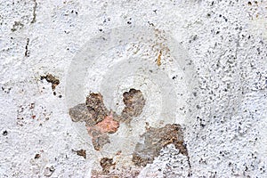 Close up view on white aged concrete walls with cracks and lots of structure