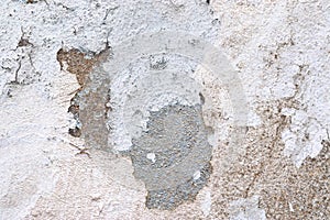 Close up view on white aged concrete walls with cracks and lots of structure