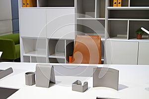 Close up view of white desktop with grey accessories for successful work