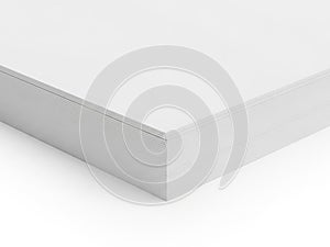 Close-up view of a white rectangular object with a textured surface isolated on white background